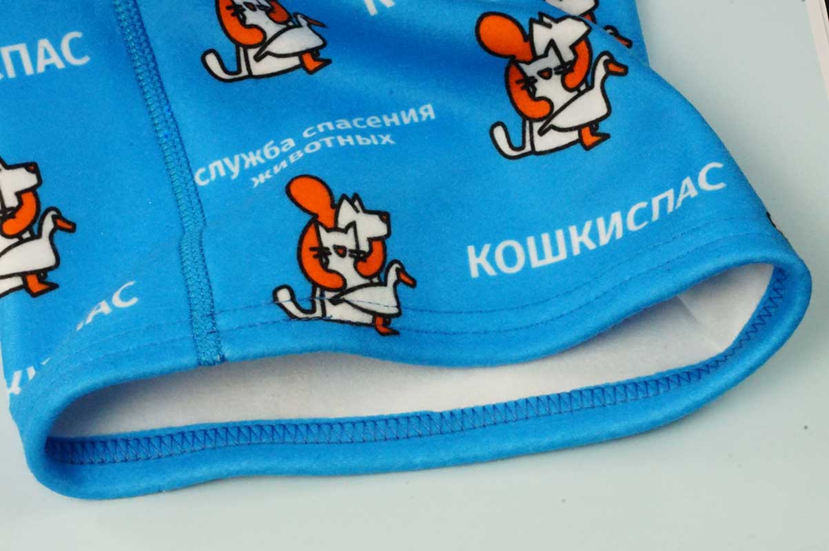 Нижний край флисового бафа с подвернутым краем, прошитым запошивочным швом